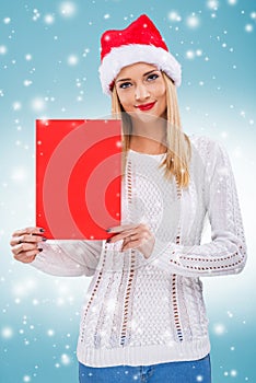 Â  Beautiful woman with santa hat, holding a red paper without subtitles